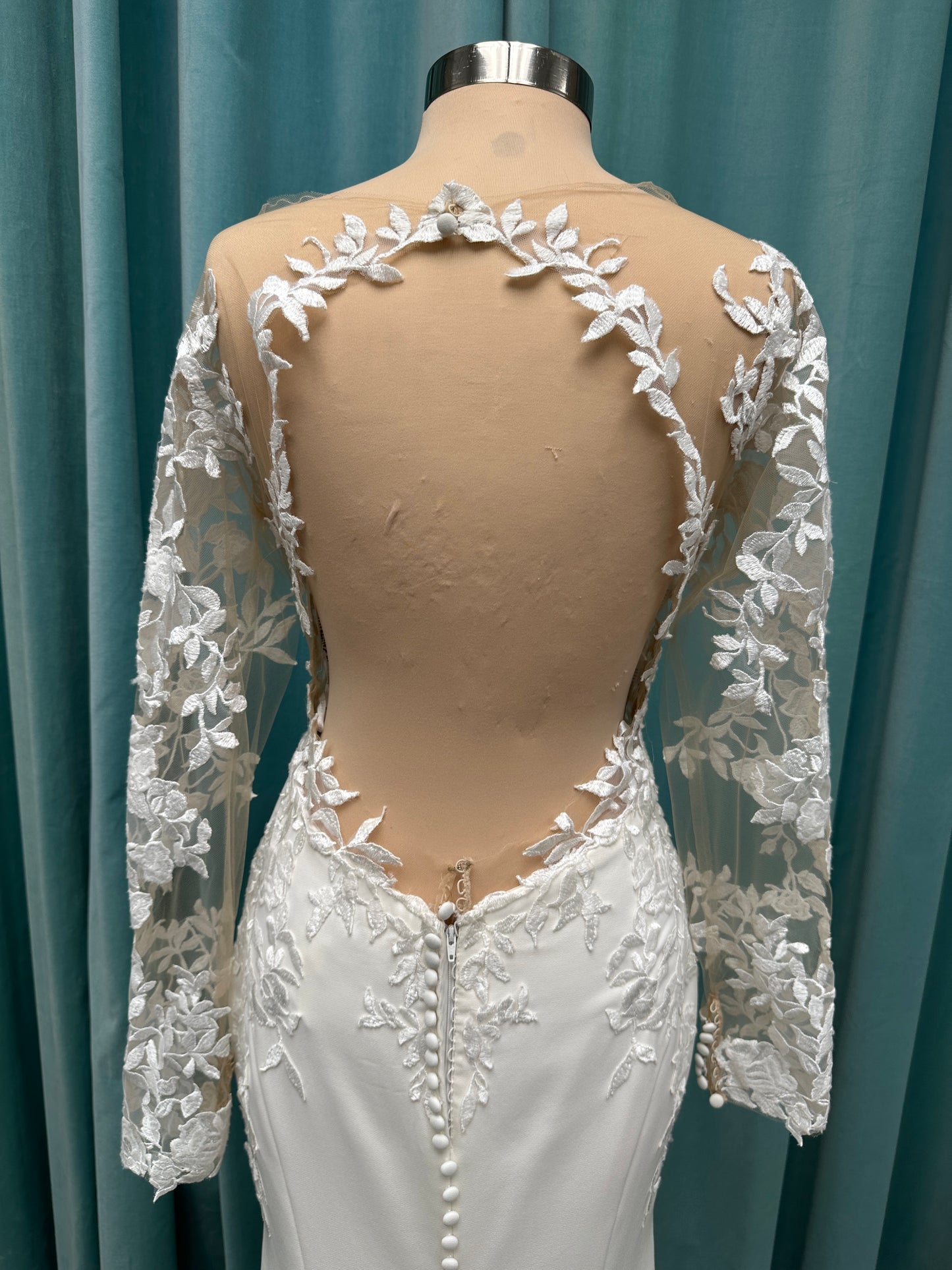 Long sleeve lace wedding dress with sheer illusion bodice and fitted skirt, featuring intricate floral lace and a soft train by Essense of Australia Style D3379