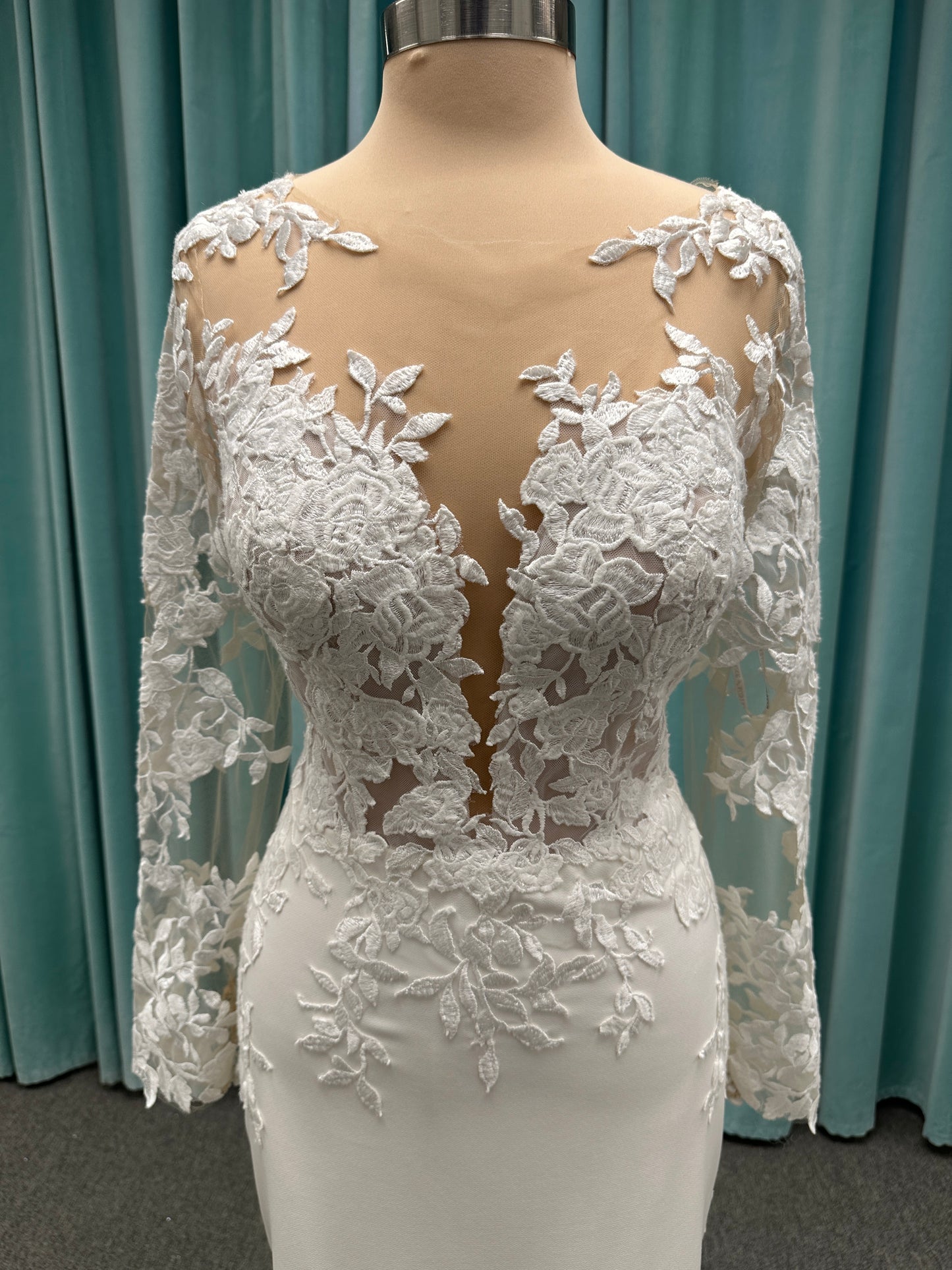 Long sleeve lace wedding dress with sheer illusion bodice and fitted skirt, featuring intricate floral lace and a soft train by Essense of Australia Style D3379