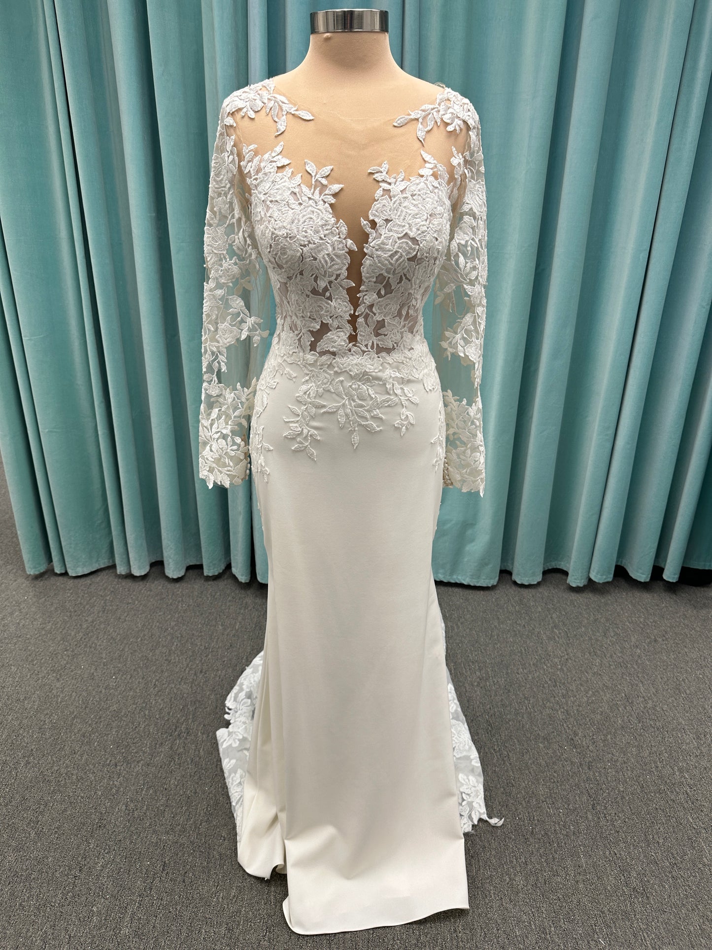 Long sleeve lace wedding dress with sheer illusion bodice and fitted skirt, featuring intricate floral lace and a soft train by Essense of Australia Style D3379