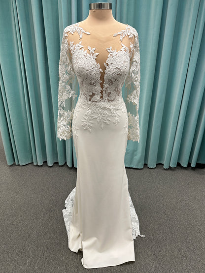 Long sleeve lace wedding dress with sheer illusion bodice and fitted skirt, featuring intricate floral lace and a soft train by Essense of Australia Style D3379