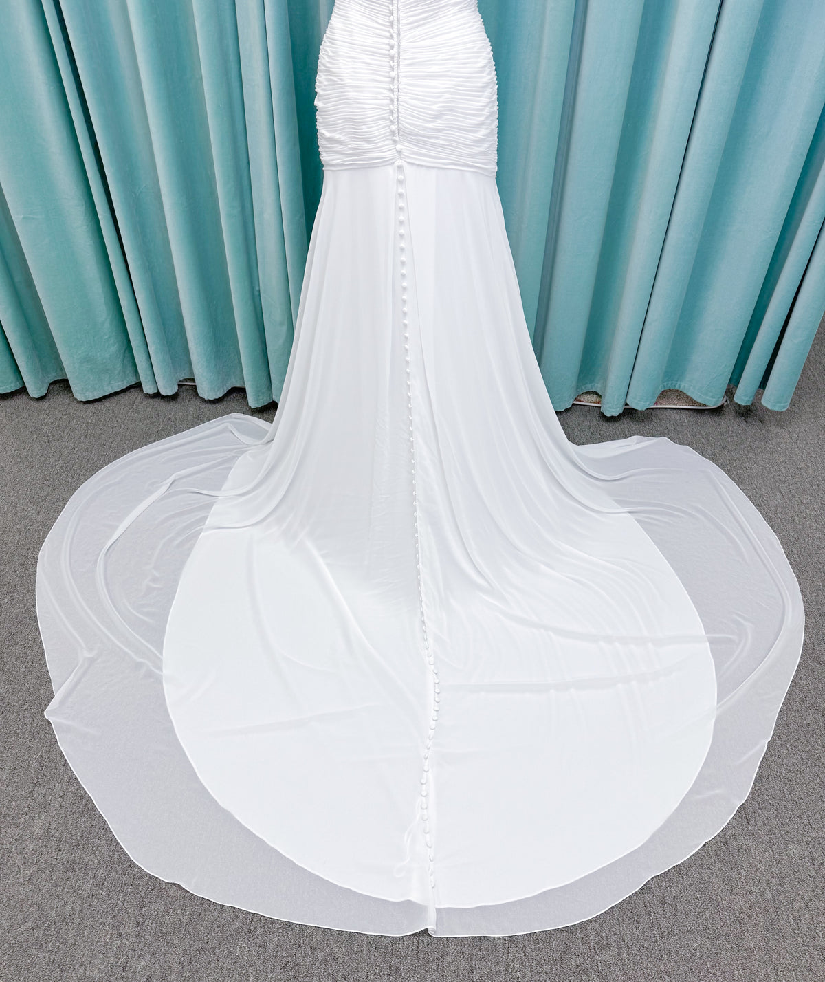 Morilee 15053 Parvati ballgown wedding dress on mannequin with draped chiffon bodice, plunging sweetheart neckline, and detachable off-the-shoulder sleeves