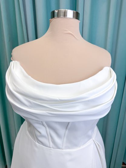 Morilee 15054 Pippa plus size A-line wedding dress in petal satin with cowl neck, corset bodice, pockets, front slit, and covered buttons to hem.