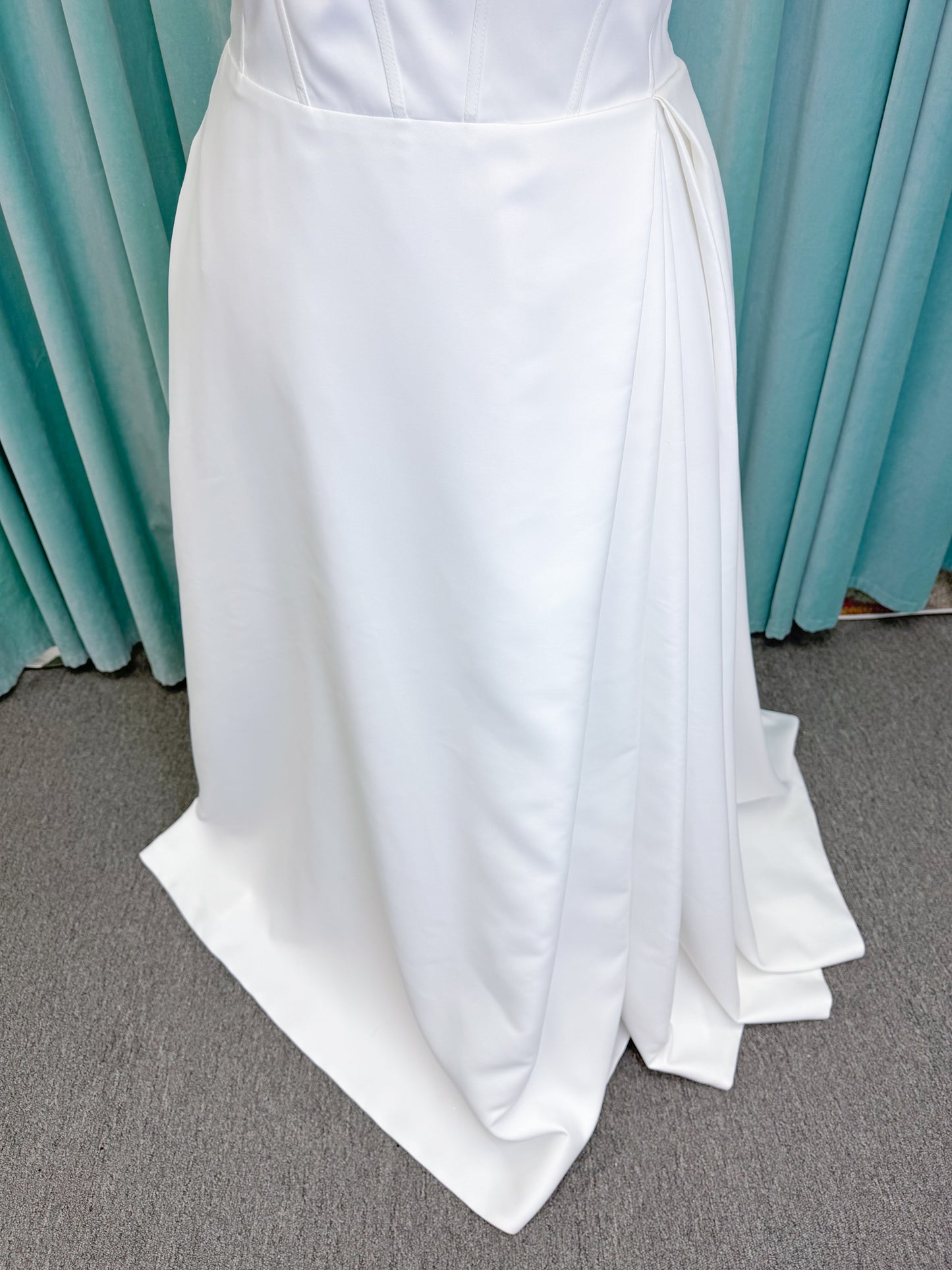 Morilee 15054 Pippa plus size A-line wedding dress in petal satin with cowl neck, corset bodice, pockets, front slit, and covered buttons to hem.
