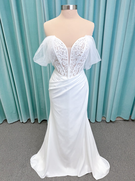Morilee 1050008 Plie fit and flare wedding dress on mannequin with fluid draping and clean silhouette