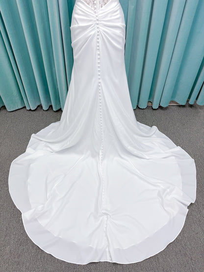 Morilee 1050008 Plie fit and flare wedding dress on mannequin with fluid draping and clean silhouette