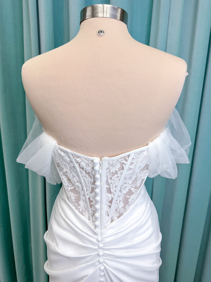 Morilee 1050008 Plie fit and flare wedding dress on mannequin with fluid draping and clean silhouette