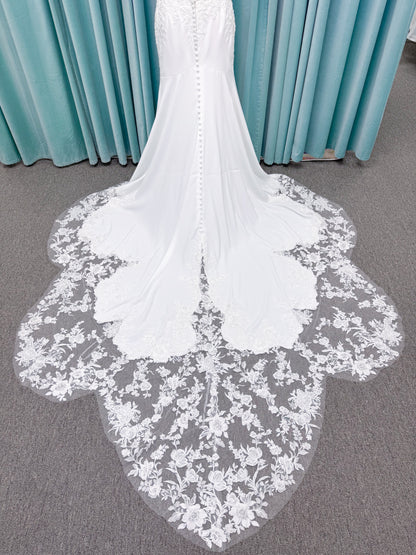 Morilee 2658 Raquel sheath wedding dress on mannequin with plunging neckline, frosted floral sparkle net bodice, crepe skirt, and keyhole back