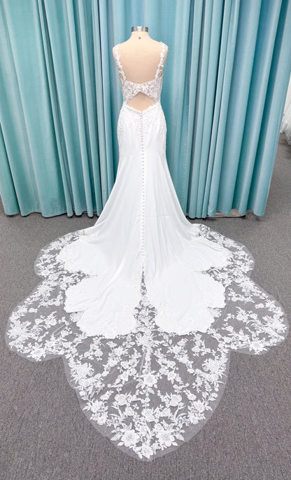 Morilee 2658 Raquel sheath wedding dress on mannequin with plunging neckline, frosted floral sparkle net bodice, crepe skirt, and keyhole back