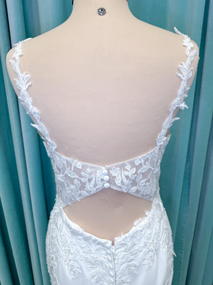 Morilee 2658 Raquel sheath wedding dress on mannequin with plunging neckline, frosted floral sparkle net bodice, crepe skirt, and keyhole back