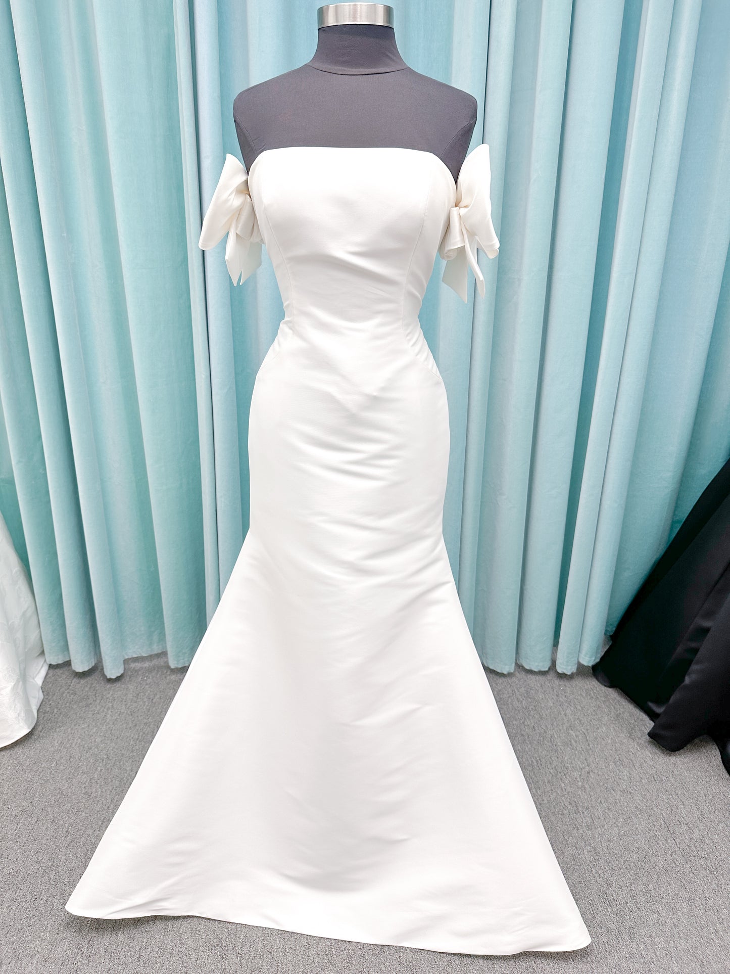 Morilee 4475 Raven fit and flare wedding dress in Larissa satin with strapless neckline, princess seams, keyhole bow back, and detachable bow sleeves.