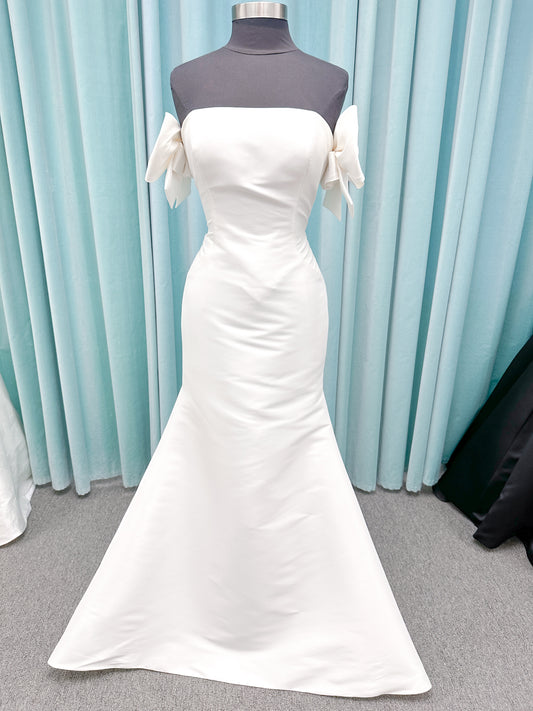 Morilee 4475 Raven fit and flare wedding dress in Larissa satin with strapless neckline, princess seams, keyhole bow back, and detachable bow sleeves.