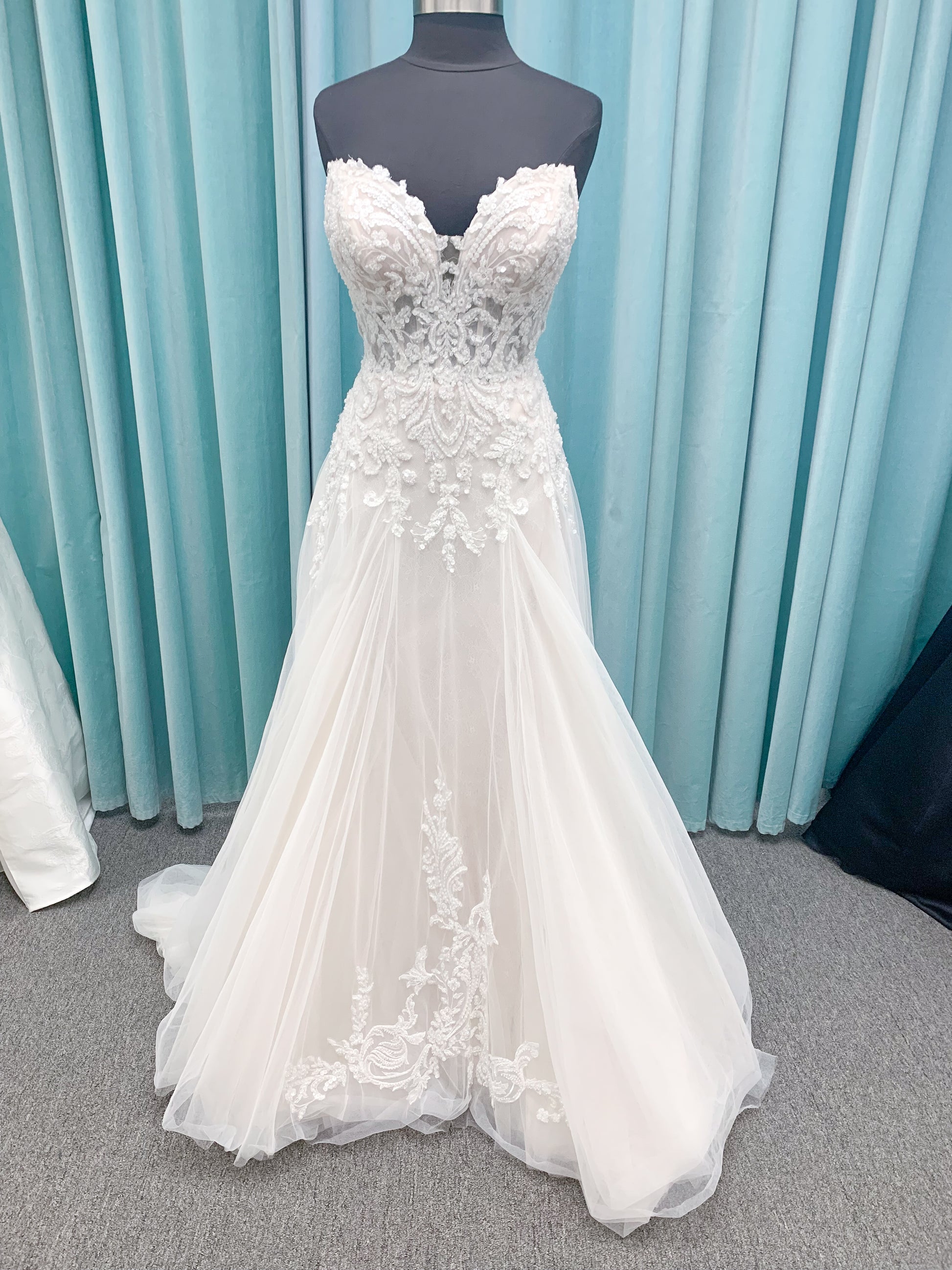 Morilee 2660 Regina A-line wedding dress with embroidered sweetheart neckline, matte sequins, drop waist, Chantilly lace tulle skirt, and lace-trimmed train.