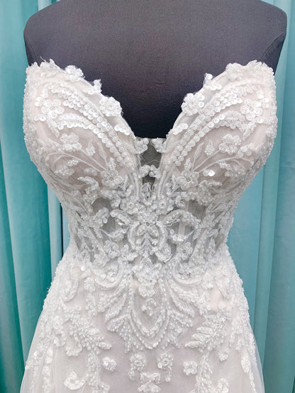 Morilee 2660 Regina A-line wedding dress with embroidered sweetheart neckline, matte sequins, drop waist, Chantilly lace tulle skirt, and lace-trimmed train.