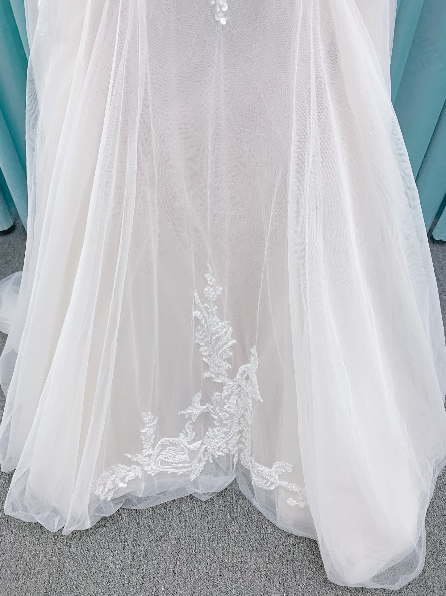 Morilee 2660 Regina A-line wedding dress with embroidered sweetheart neckline, matte sequins, drop waist, Chantilly lace tulle skirt, and lace-trimmed train.