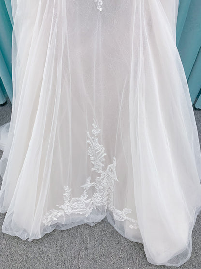 Morilee 2660 Regina A-line wedding dress with embroidered sweetheart neckline, matte sequins, drop waist, Chantilly lace tulle skirt, and lace-trimmed train.