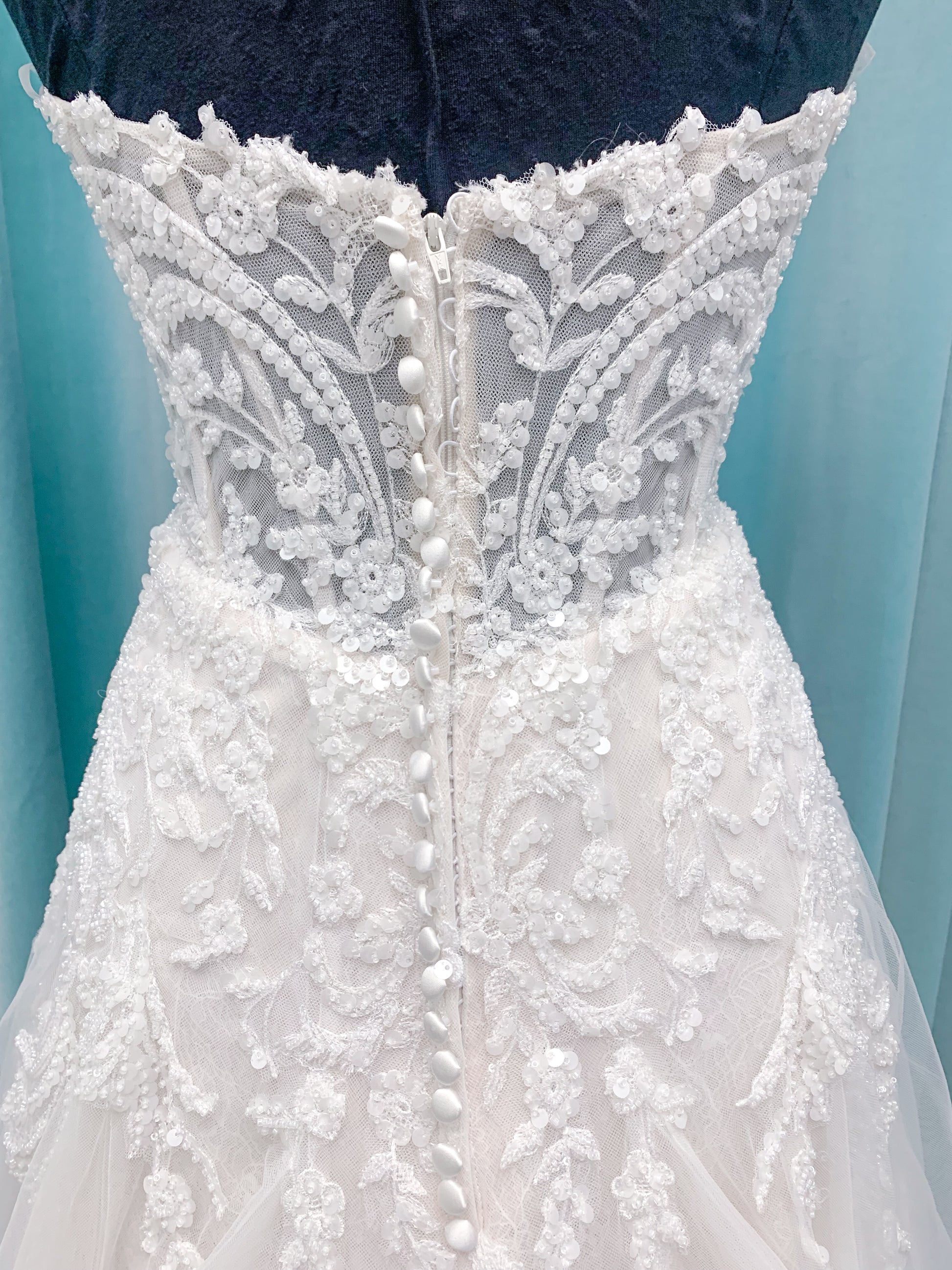 Morilee 2660 Regina A-line wedding dress with embroidered sweetheart neckline, matte sequins, drop waist, Chantilly lace tulle skirt, and lace-trimmed train.