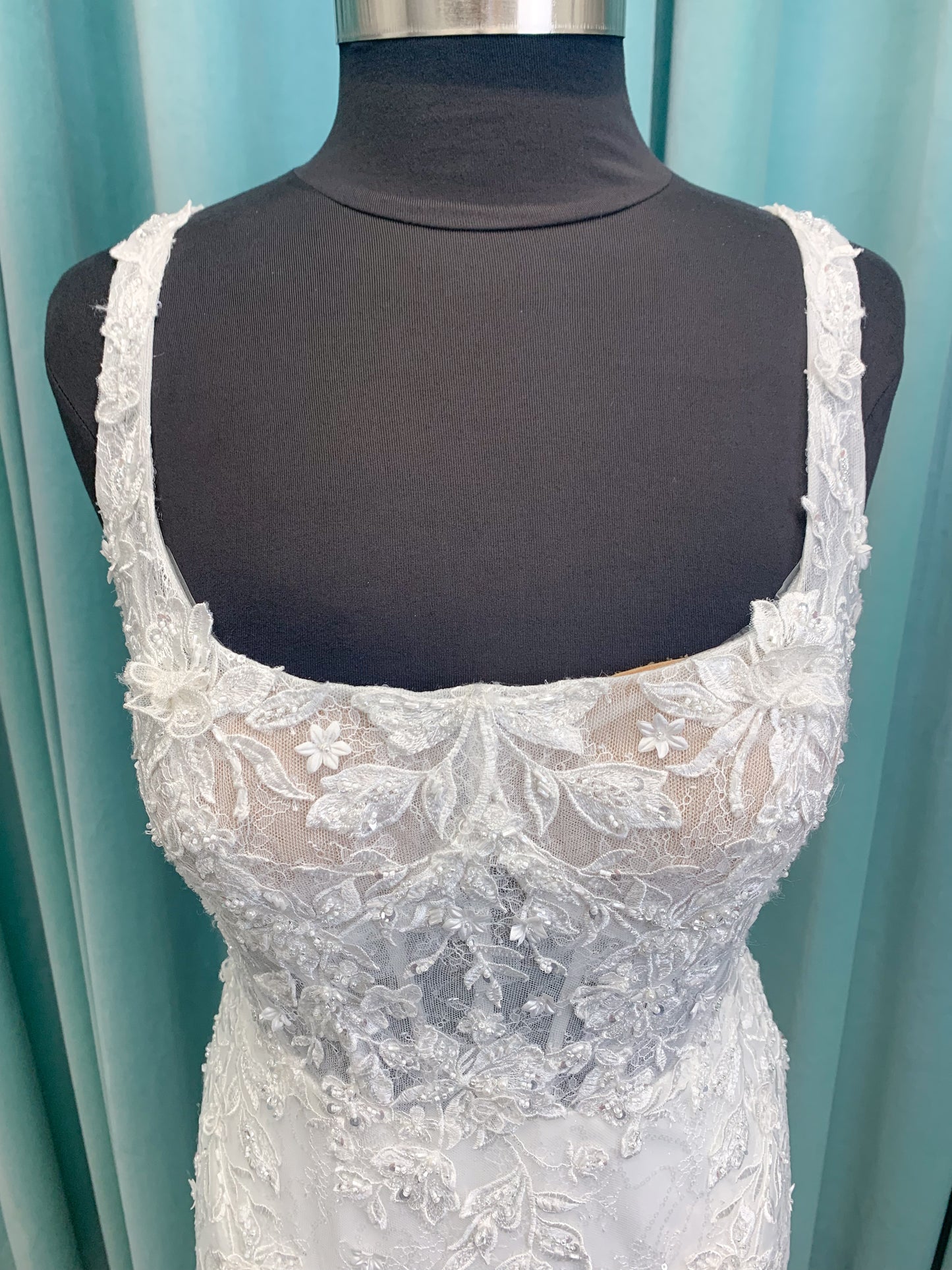 Morilee 2650 Rhea fit and flare wedding dress with square neckline, 3D beaded floral lace over sparkle tulle, corset boning, keyhole back, and godet skirt insets.