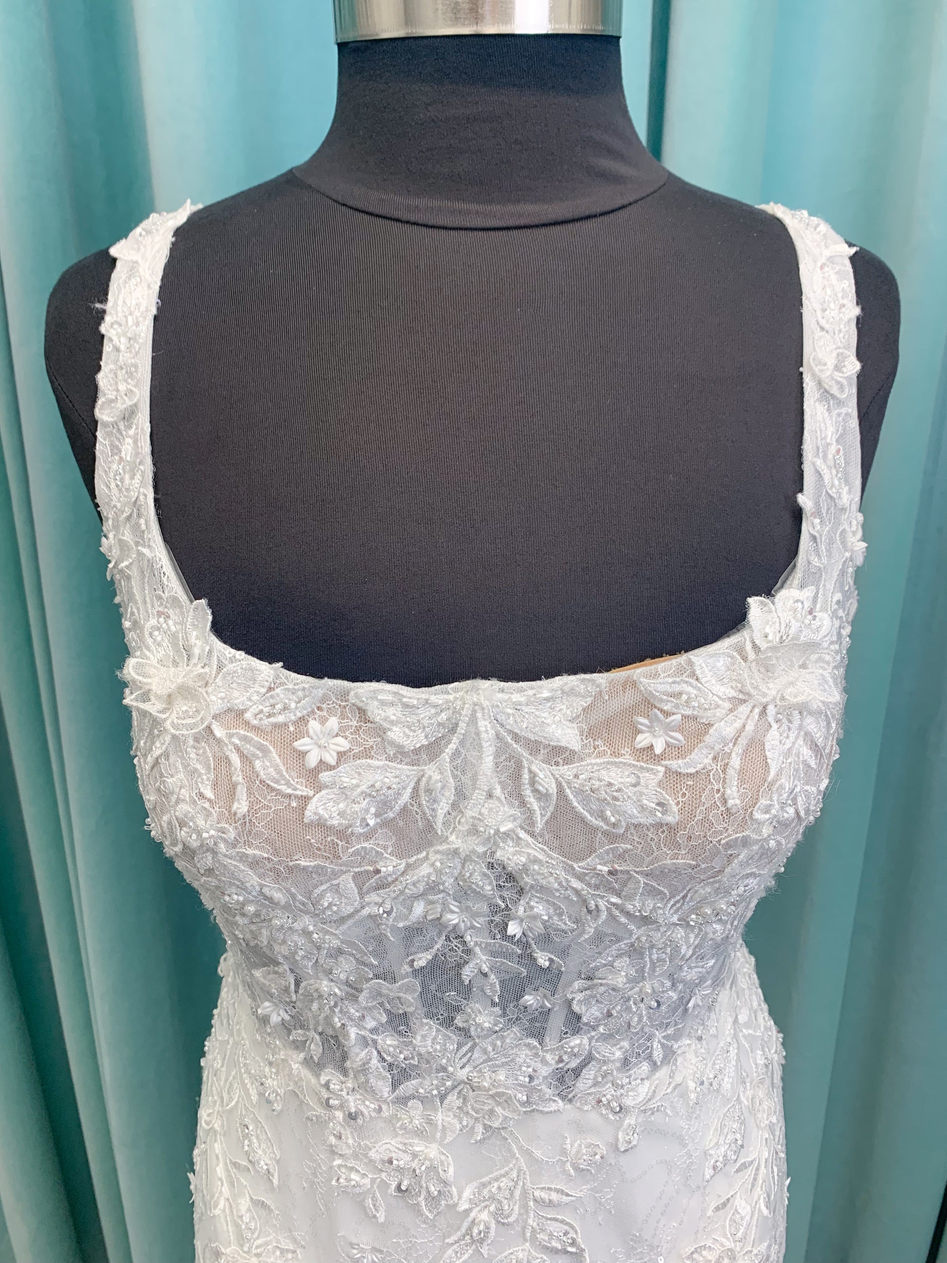 Morilee 2650 Rhea fit and flare wedding dress with square neckline, 3D beaded floral lace over sparkle tulle, corset boning, keyhole back, and godet skirt insets.