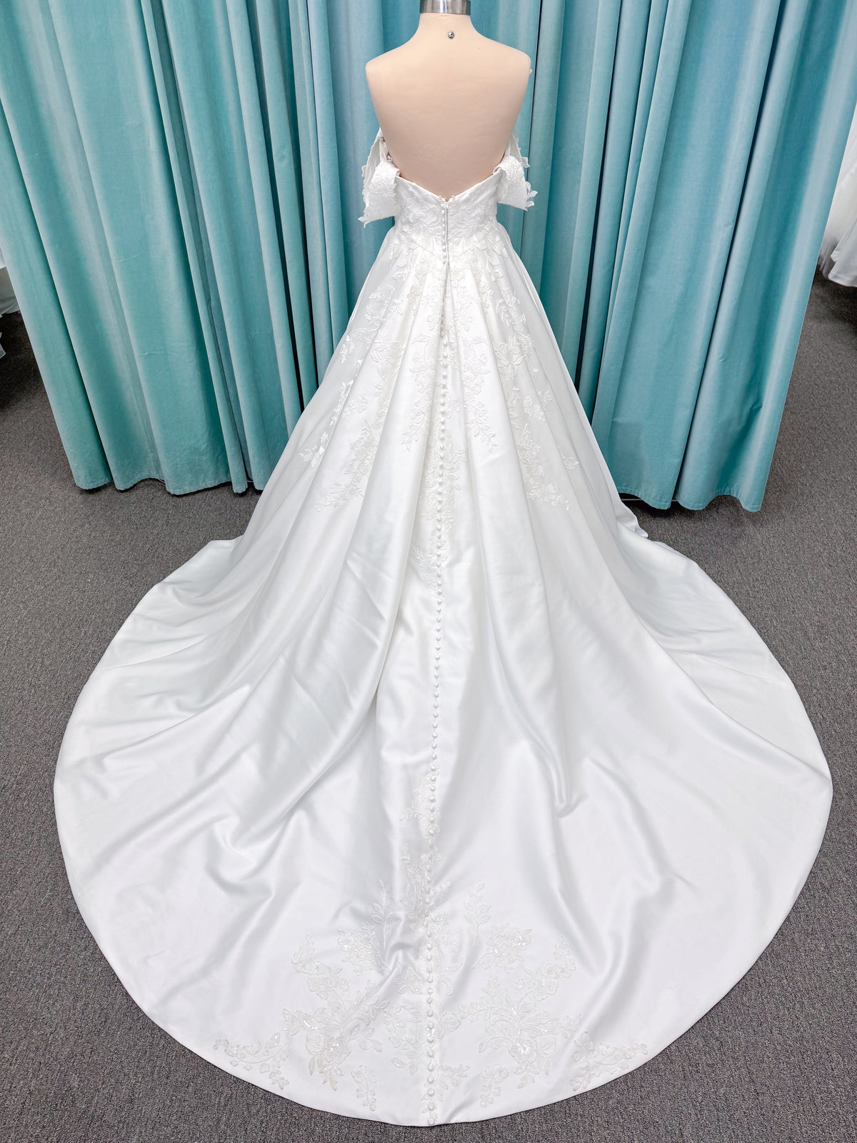 Morilee 2643 Rosemarie A-line wedding dress on mannequin with sweetheart plunging neckline, long sleeves, and frosted embroidered lace appliques