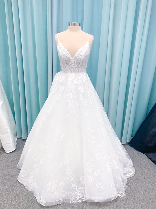 Morilee 2988 Rosie ball gown wedding dress in rose-printed organza over glitter tulle with V-neck, thin straps, structured boning, and voluminous sweeping train.