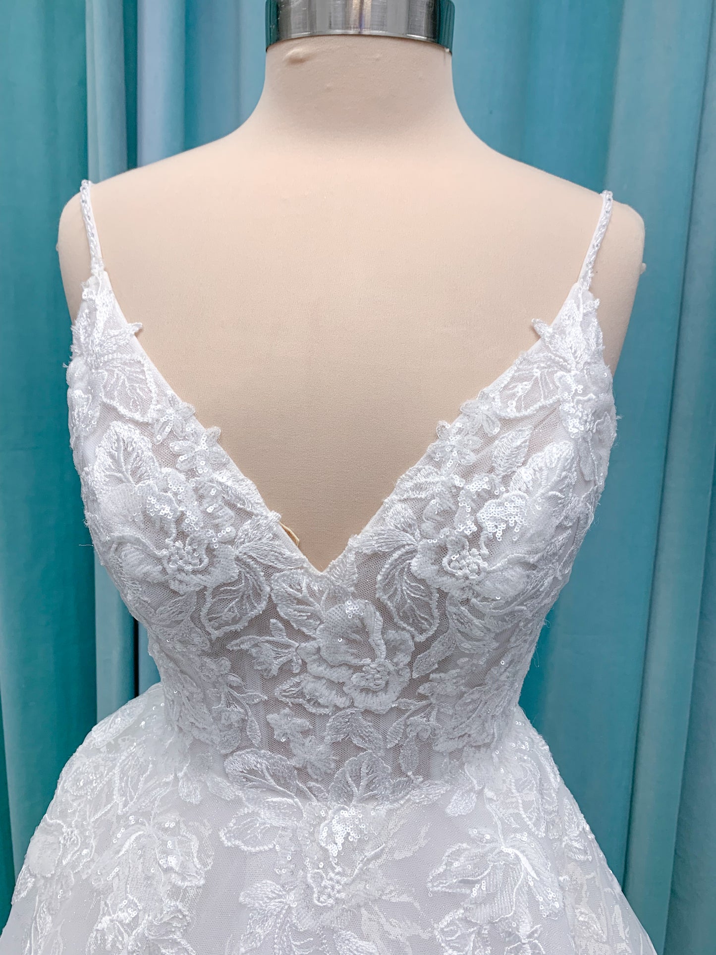 Morilee 2988 Rosie ball gown wedding dress in rose-printed organza over glitter tulle with V-neck, thin straps, structured boning, and voluminous sweeping train.