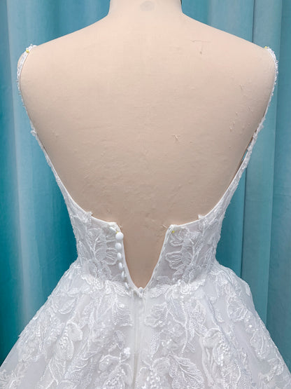 Morilee 2988 Rosie ball gown wedding dress in rose-printed organza over glitter tulle with V-neck, thin straps, structured boning, and voluminous sweeping train.
