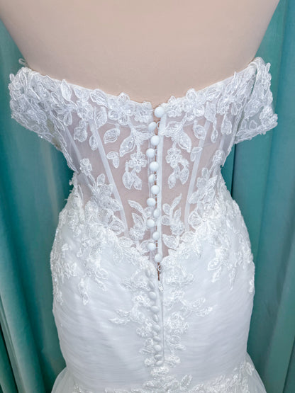 Morilee 4467 Rowena fit and flare wedding dress on mannequin with sheer corset bodice, frosted lace appliques, sweetheart neckline, and detachable off-the-shoulder sleeves