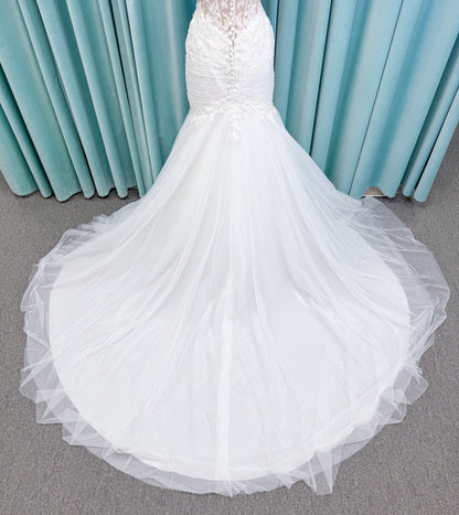 Morilee 4467 Rowena fit and flare wedding dress on mannequin with sheer corset bodice, frosted lace appliques, sweetheart neckline, and detachable off-the-shoulder sleeves