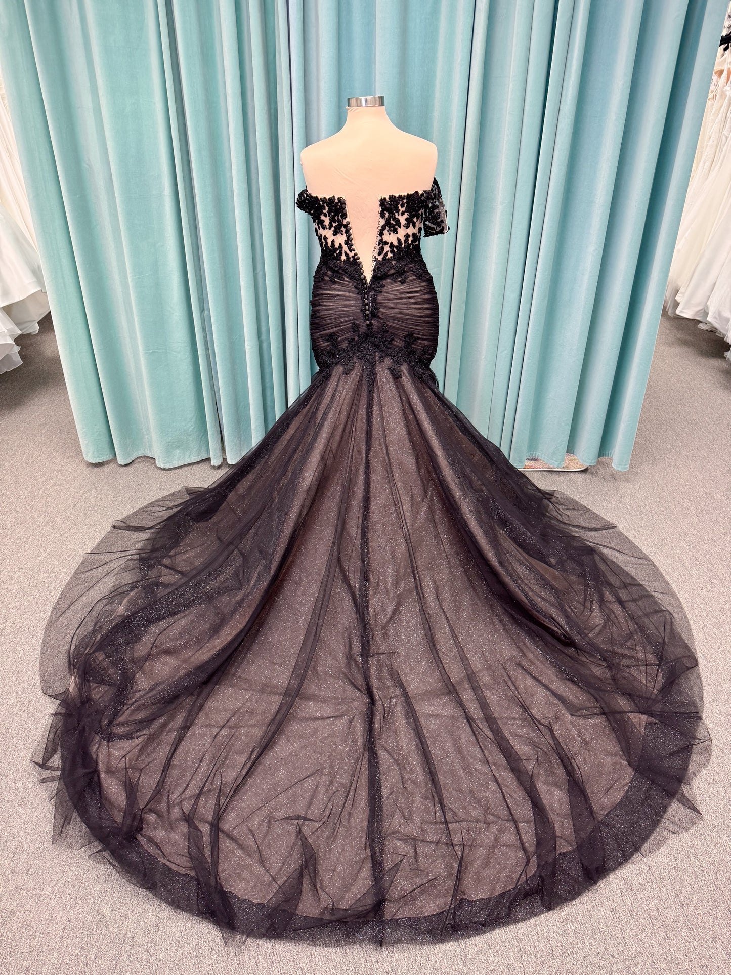 Morilee 4467 Rowena fit and flare wedding dress on mannequin with sheer corset bodice, frosted lace appliques, sweetheart neckline, and detachable off-the-shoulder sleeves