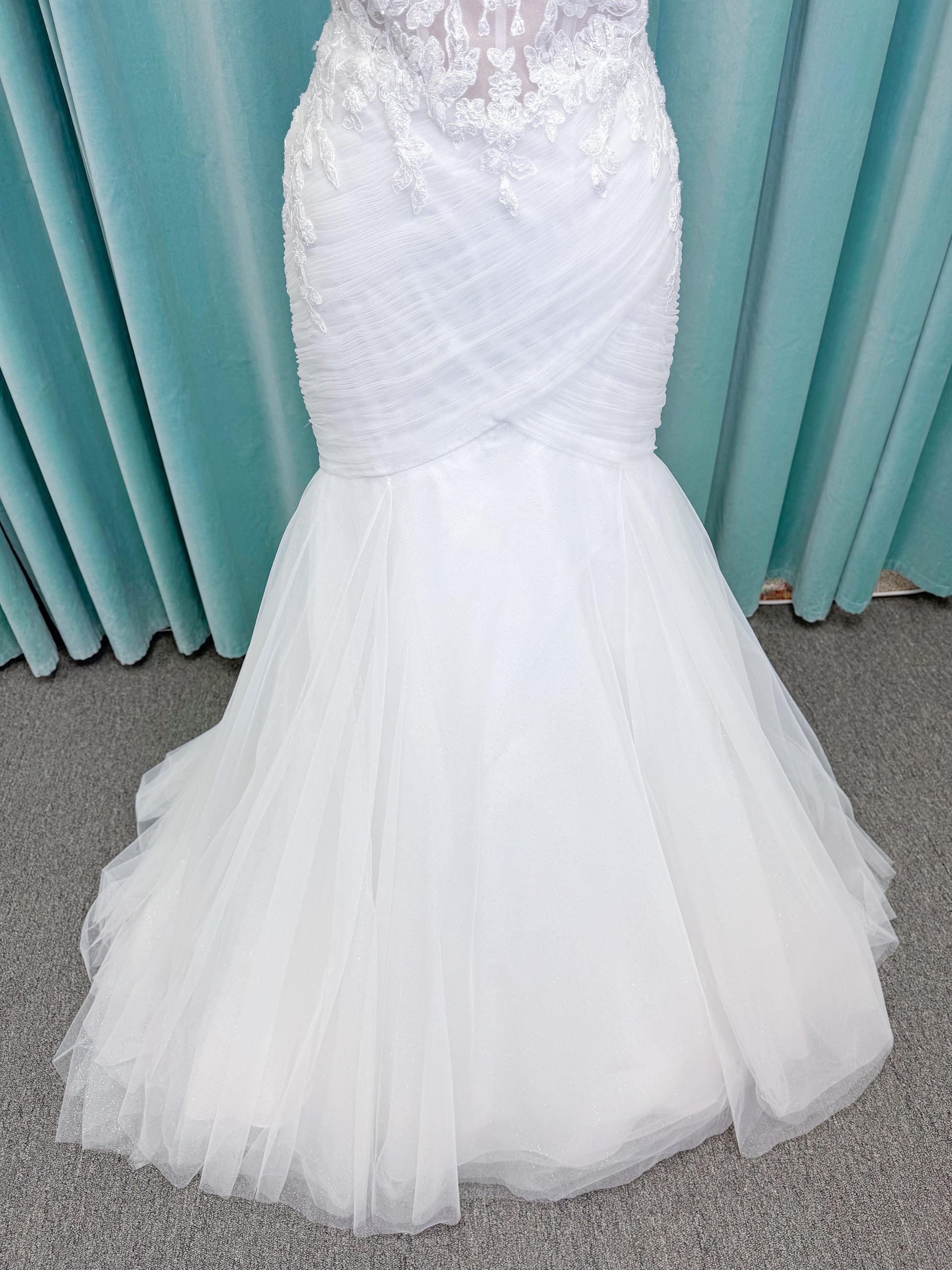 Morilee 4467 Rowena fit and flare wedding dress on mannequin with sheer corset bodice, frosted lace appliques, sweetheart neckline, and detachable off-the-shoulder sleeves