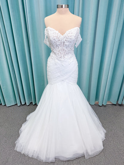 Morilee 4467 Rowena fit and flare wedding dress on mannequin with sheer corset bodice, frosted lace appliques, sweetheart neckline, and detachable off-the-shoulder sleeves