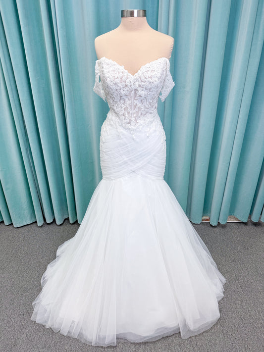 Morilee 4467 Rowena fit and flare wedding dress on mannequin with sheer corset bodice, frosted lace appliques, sweetheart neckline, and detachable off-the-shoulder sleeves