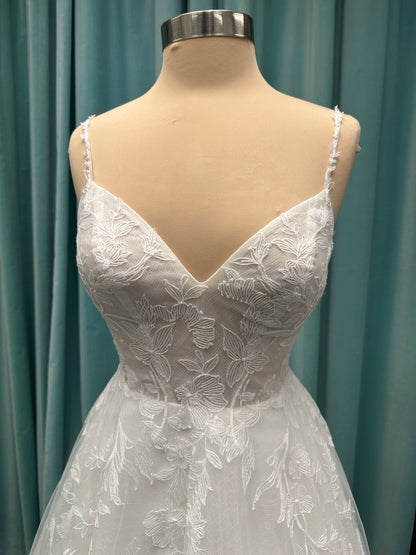 Stella York SY8153 ballgown featuring 3D lace spaghetti strap bodice with sheer V-neckline and layered tulle skirt with floral appliqués