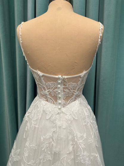 Stella York SY8153 ballgown featuring 3D lace spaghetti strap bodice with sheer V-neckline and layered tulle skirt with floral appliqués