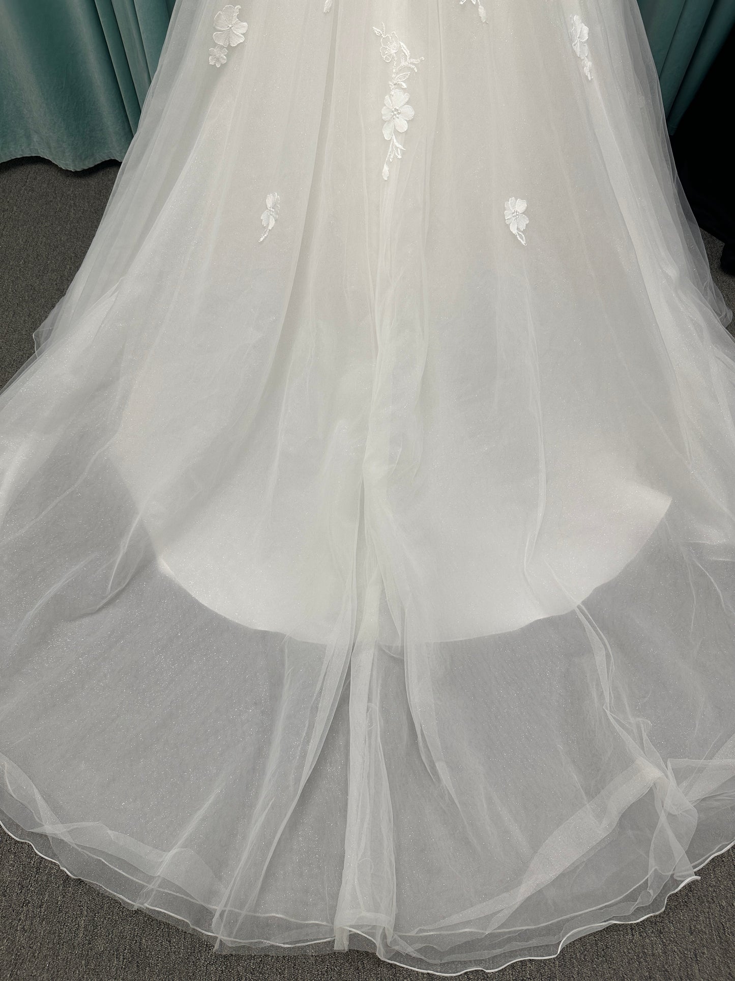 Stella York Style 8012 lace and tulle ballgown wedding dress with sheer sweetheart bodice, off-the-shoulder long lace sleeves, and full princess skirt