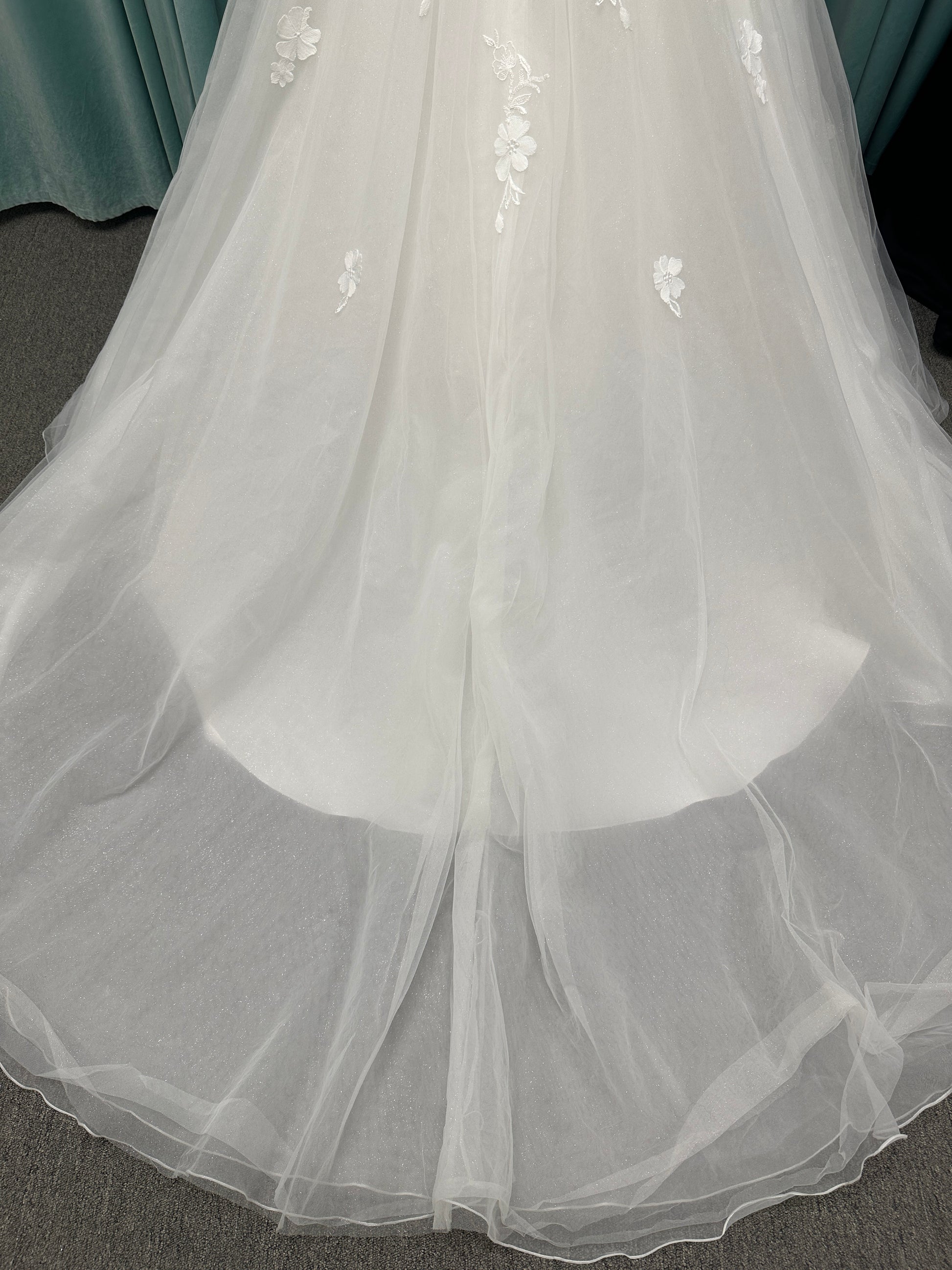 Stella York Style 8012 lace and tulle ballgown wedding dress with sheer sweetheart bodice, off-the-shoulder long lace sleeves, and full princess skirt
