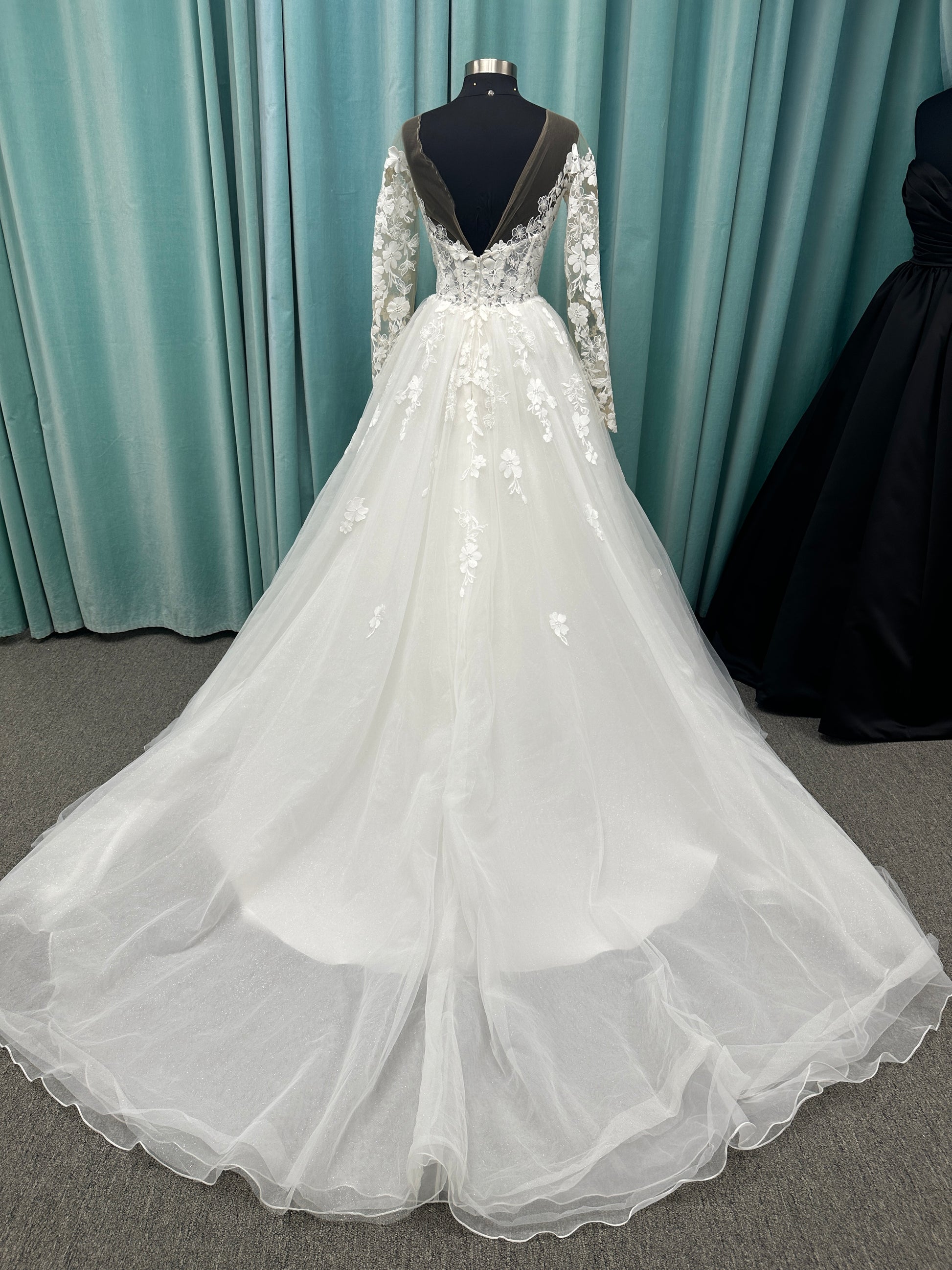 Stella York Style 8012 lace and tulle ballgown wedding dress with sheer sweetheart bodice, off-the-shoulder long lace sleeves, and full princess skirt