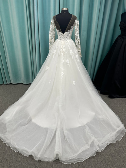 Stella York Style 8012 lace and tulle ballgown wedding dress with sheer sweetheart bodice, off-the-shoulder long lace sleeves, and full princess skirt