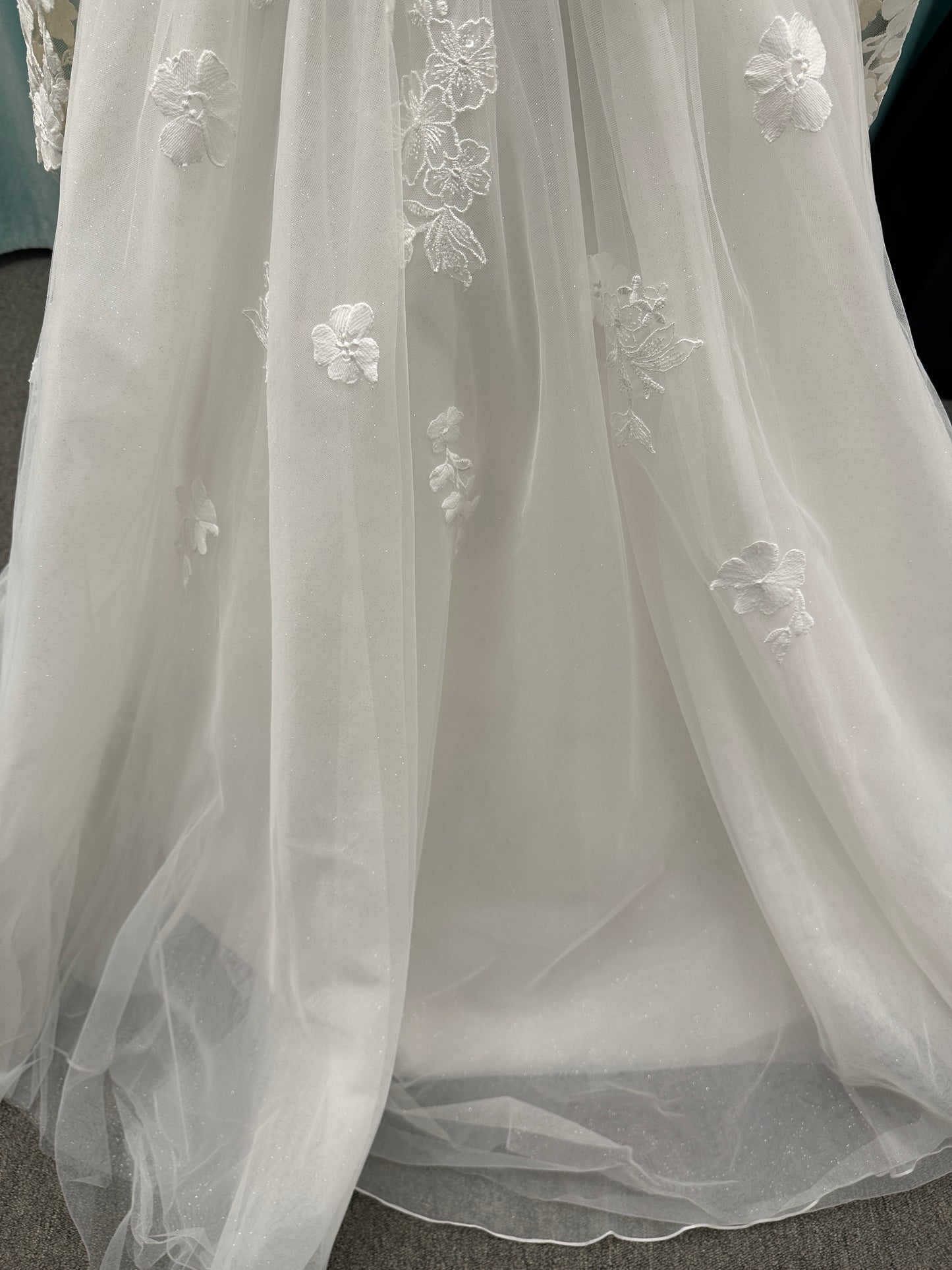 Stella York Style 8012 lace and tulle ballgown wedding dress with sheer sweetheart bodice, off-the-shoulder long lace sleeves, and full princess skirt