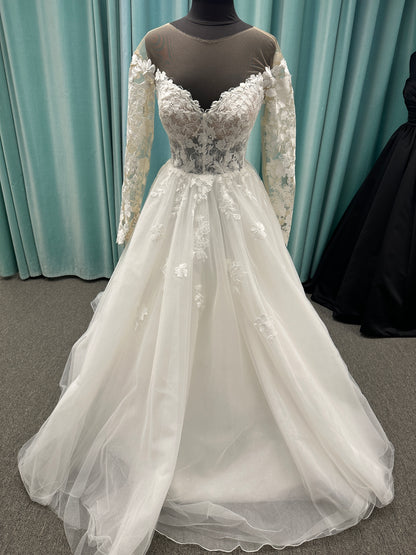 Stella York Style 8012 lace and tulle ballgown wedding dress with sheer sweetheart bodice, off-the-shoulder long lace sleeves, and full princess skirt