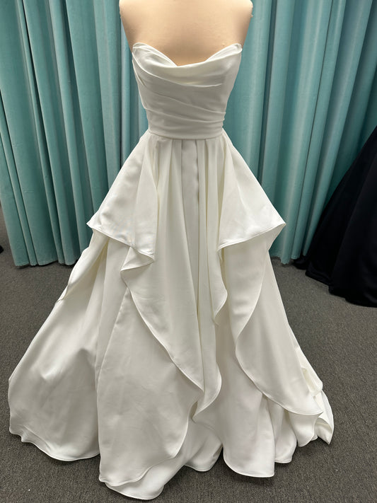 Strapless satin A-line wedding dress with ruched bodice and soft ruffle pick-up skirt by Stella York style SY8212