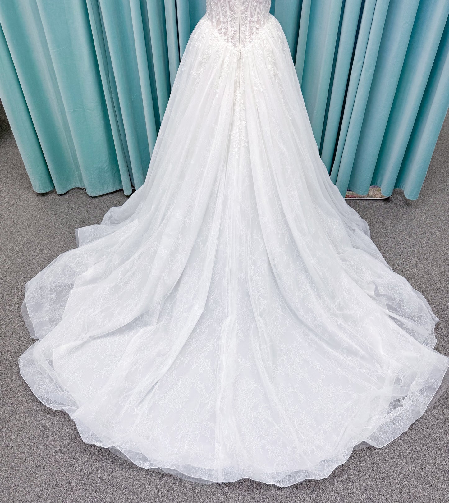 Morilee 2714 Seattle ballgown wedding dress on mannequin with crescent neckline, beaded embroidered lace, basque waist, and detachable illusion sleeves