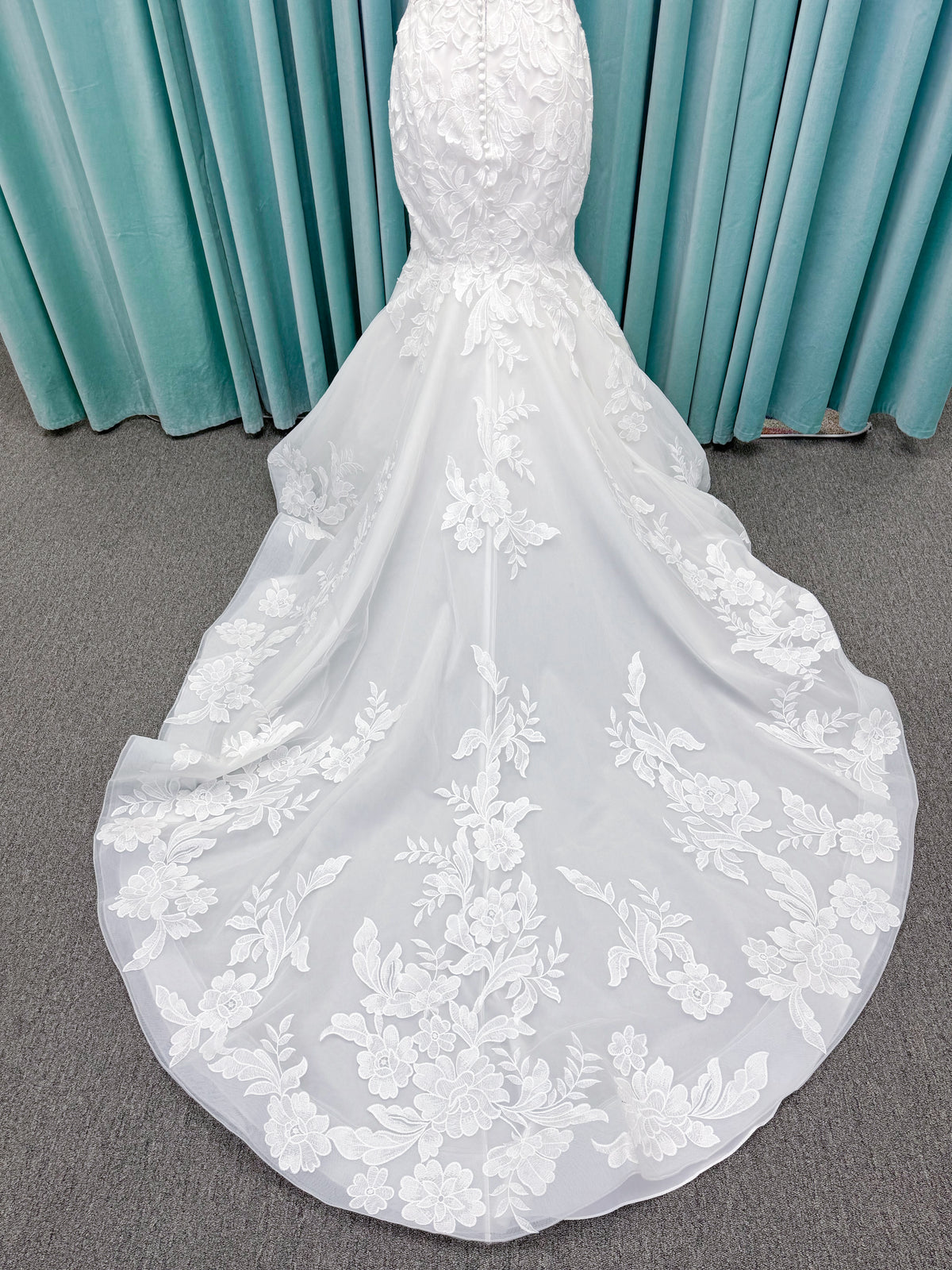 Morilee 2904 Selene fit and flare wedding dress on mannequin with spaghetti straps, plunge neckline, illusion side cutouts, and open back