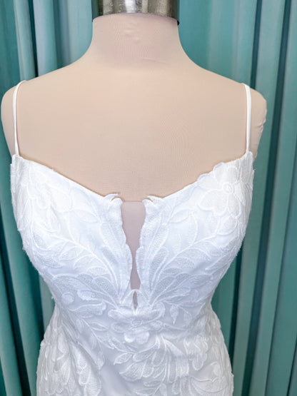 Morilee 2904 Selene fit and flare wedding dress on mannequin with spaghetti straps, plunge neckline, illusion side cutouts, and open back