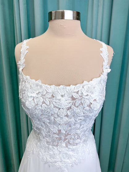 Morilee 15108 Senna boho A-line wedding dress on mannequin with square neckline, 3D floral lace bodice, and flowing chiffon skirt