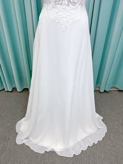 Morilee 15108 Senna boho A-line wedding dress on mannequin with square neckline, 3D floral lace bodice, and flowing chiffon skirt