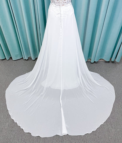 Morilee 15108 Senna boho A-line wedding dress on mannequin with square neckline, 3D floral lace bodice, and flowing chiffon skirt