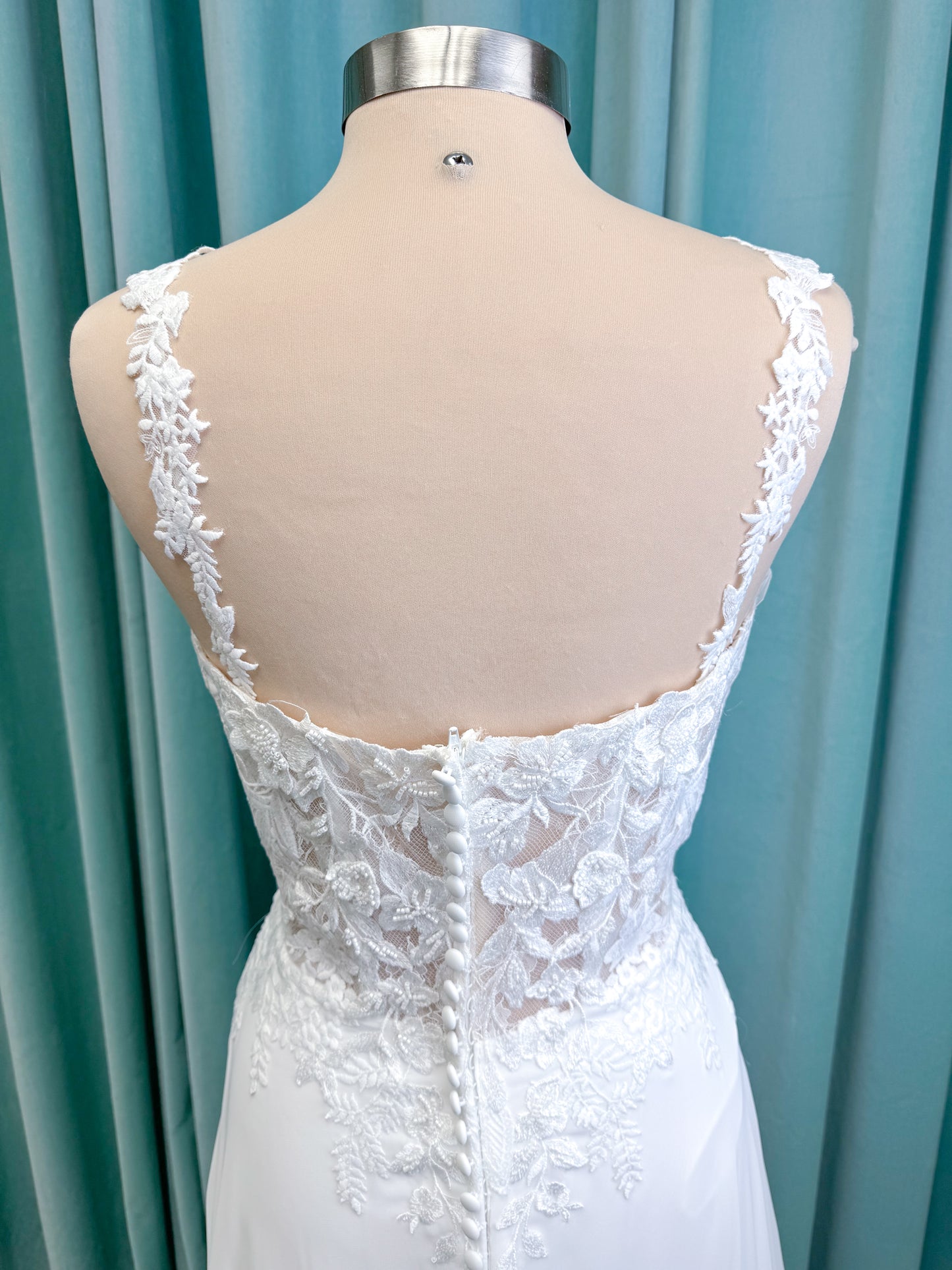 Morilee 15108 Senna boho A-line wedding dress on mannequin with square neckline, 3D floral lace bodice, and flowing chiffon skirt