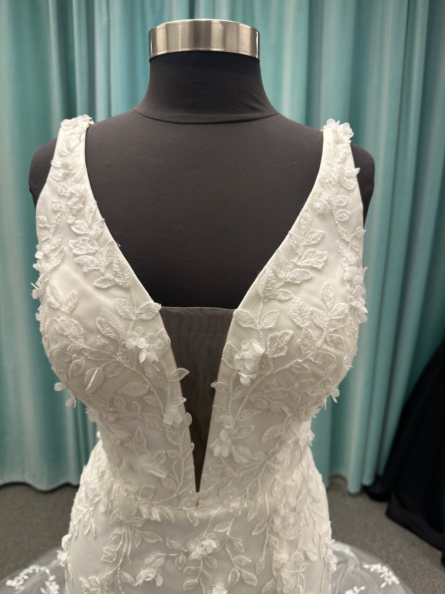 Stella York SY8157 glitter tulle fit-and-flare wedding dress with plunge neckline and floral lace appliqués