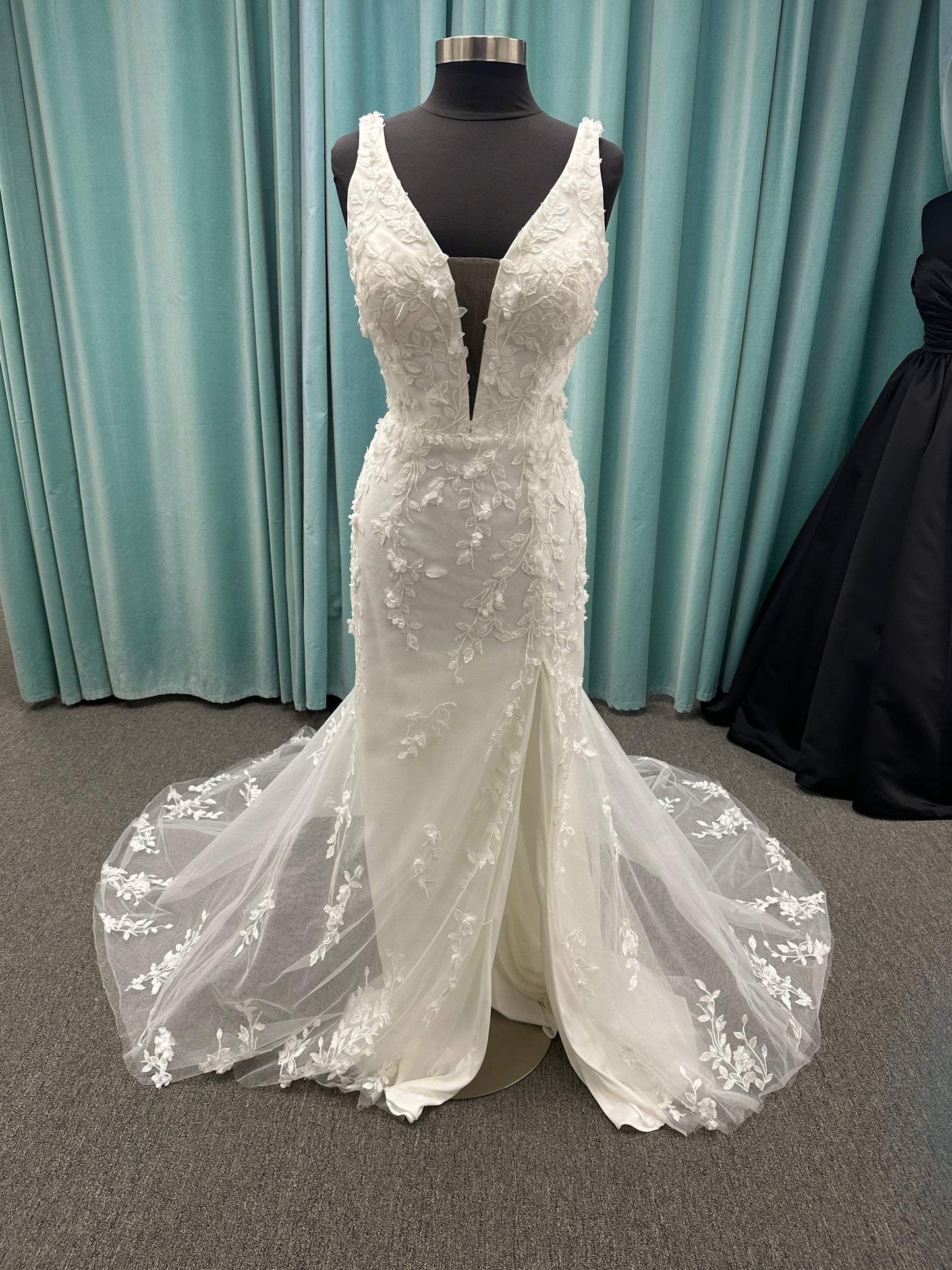 Stella York SY8157 glitter tulle fit-and-flare wedding dress with plunge neckline and floral lace appliqués